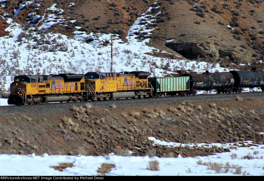 UP 9049, 7109 (SD70ACE, C44ACM) lead a westbound manifest at Castle Rock, Utah. February 19, 2022 {Winter Echofest}